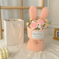 Hand-tied bouquet in rabbit ear wrap for romantic occasions