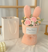 Hand-tied bouquet in rabbit ear wrap for romantic occasions